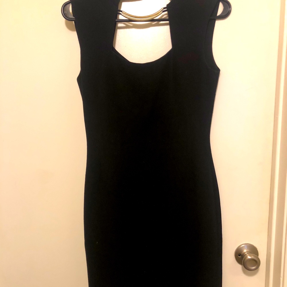 Black tight fitted dress.
